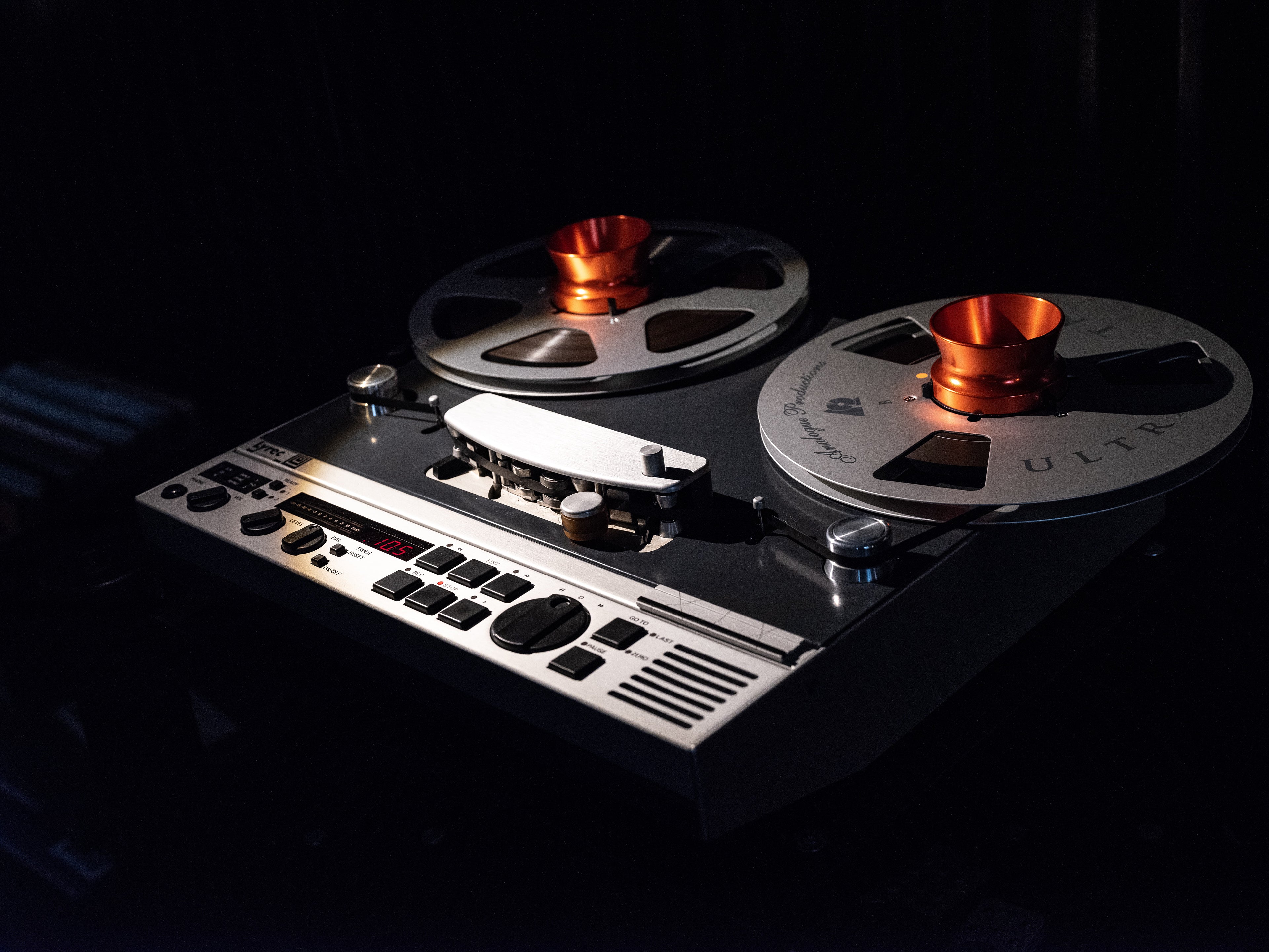 Vintage reel-to-reel tape recorder showcasing features in the context of Electronic Sales.