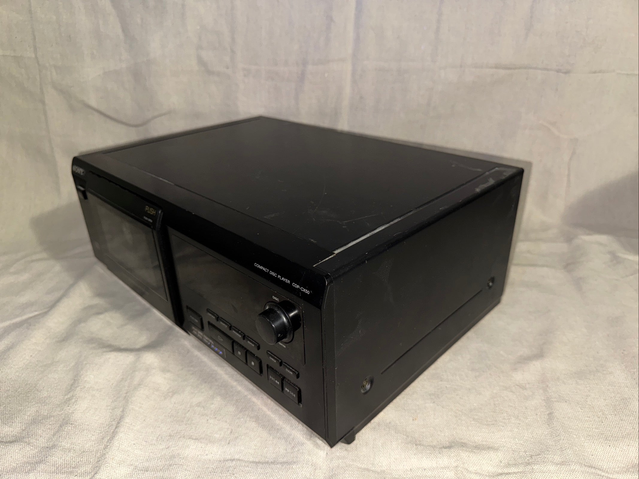 Serviced Sony CDP-CX50 audio device in great working condition on a plain background.