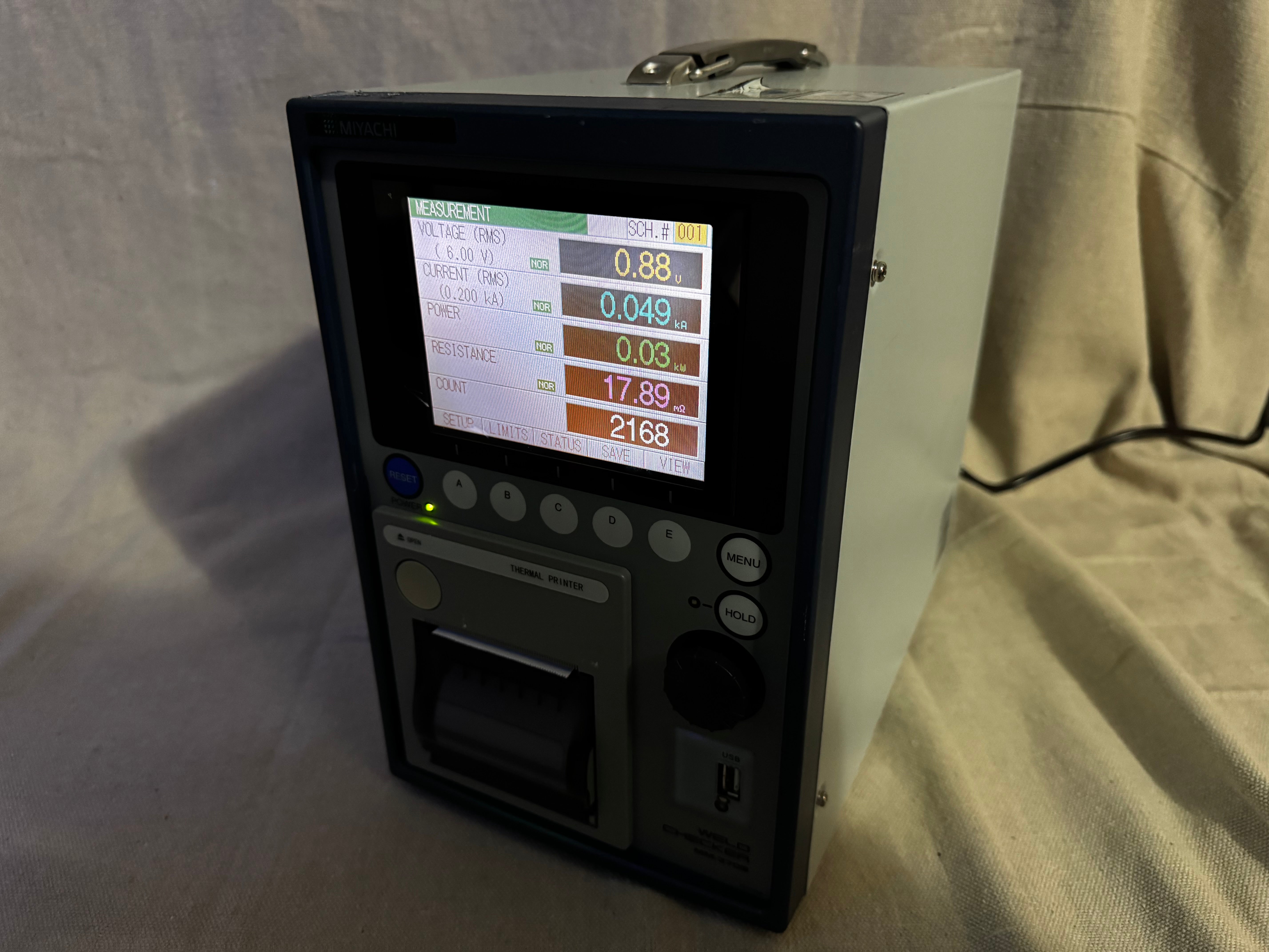 Miyachi MM-370B Weld Checker displaying multiple waveform measurements on screen.