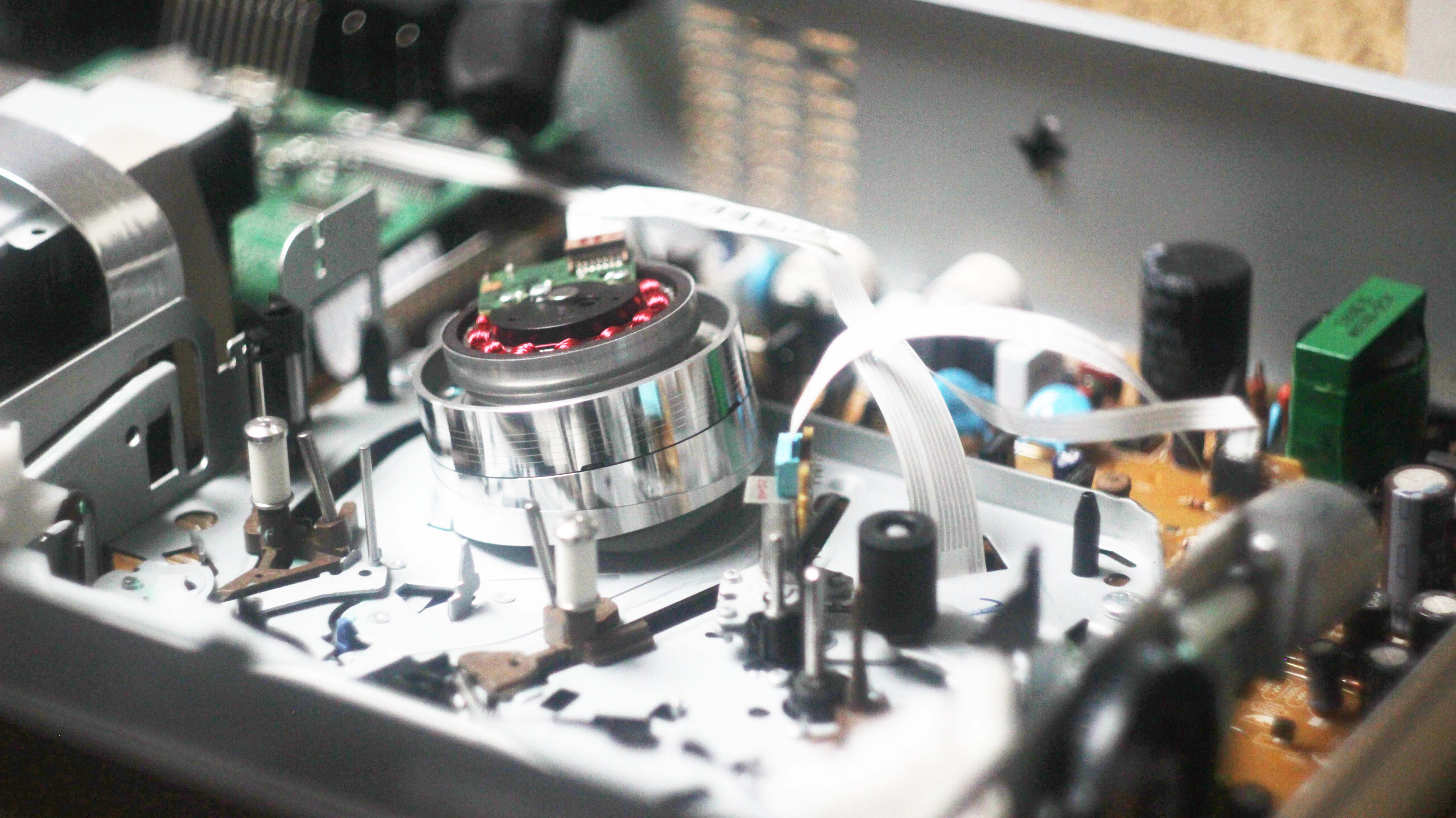 Inside view of a VHS VCR and Betamax player showcasing intricate components for repair services.