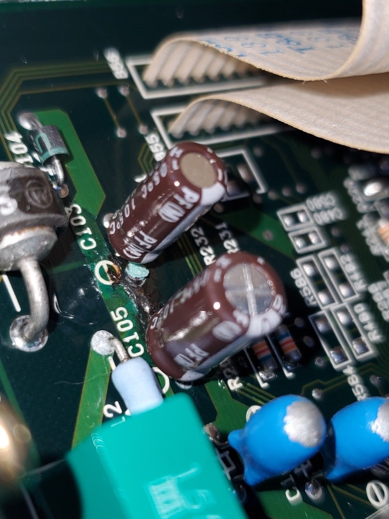 Lexus and Toyota Engine Control Module ECM Mail In Capacitor Replacement service capacitor components in circuit board.