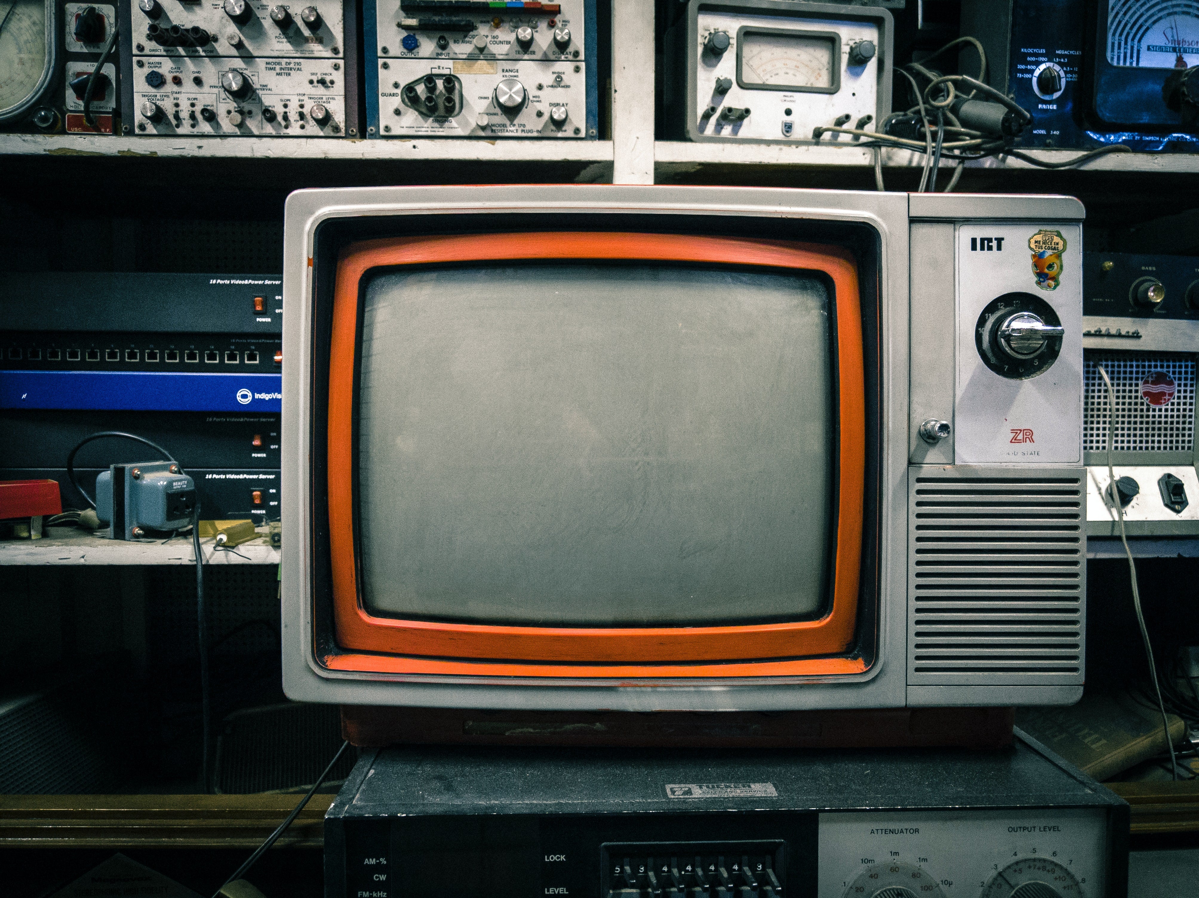 Vintage television with an orange trim displaying the concept of Television Parts.