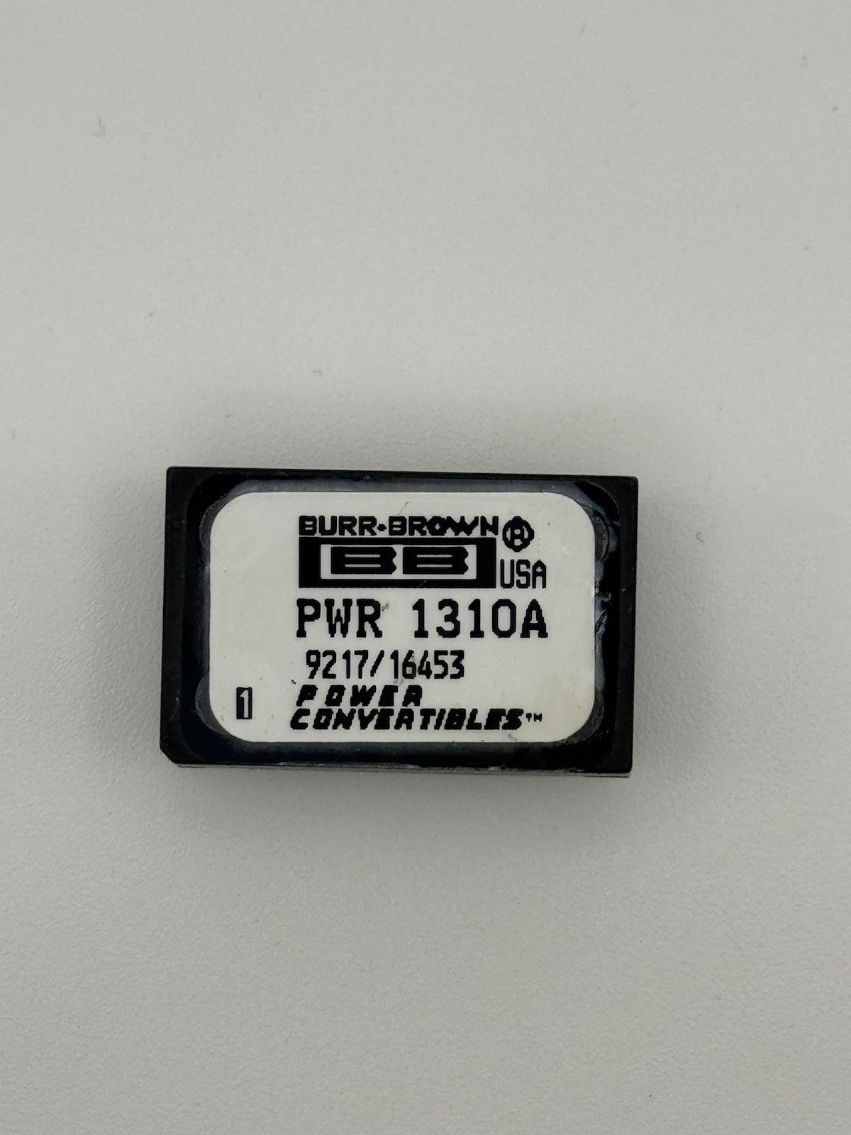 Burr-Brown PWR1310A Isolated DC/DC Converter | ±12V Dual Output 2W Module packaging image.