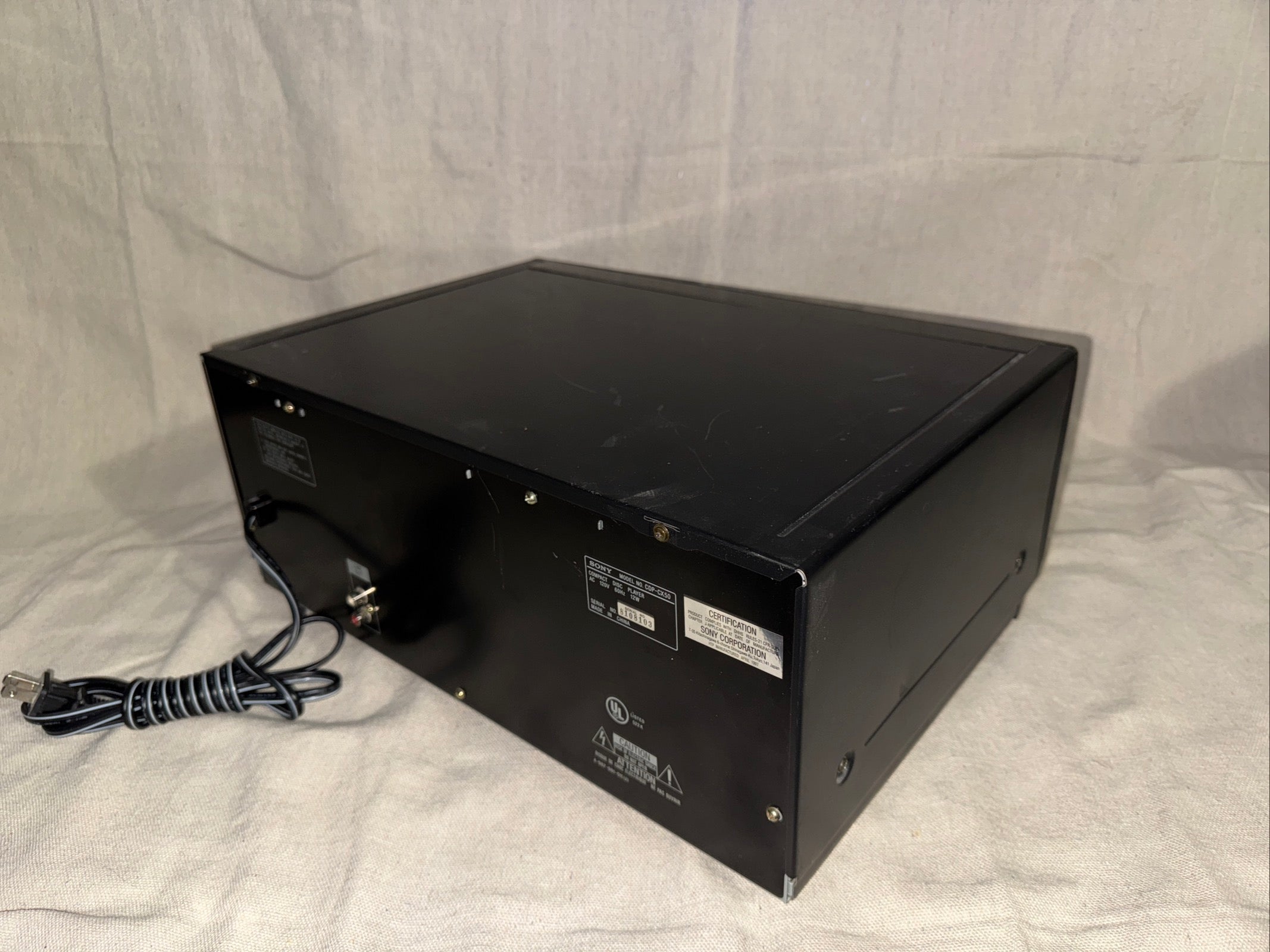 Serviced Sony CDP-CX50, back view showing connections and power cord.