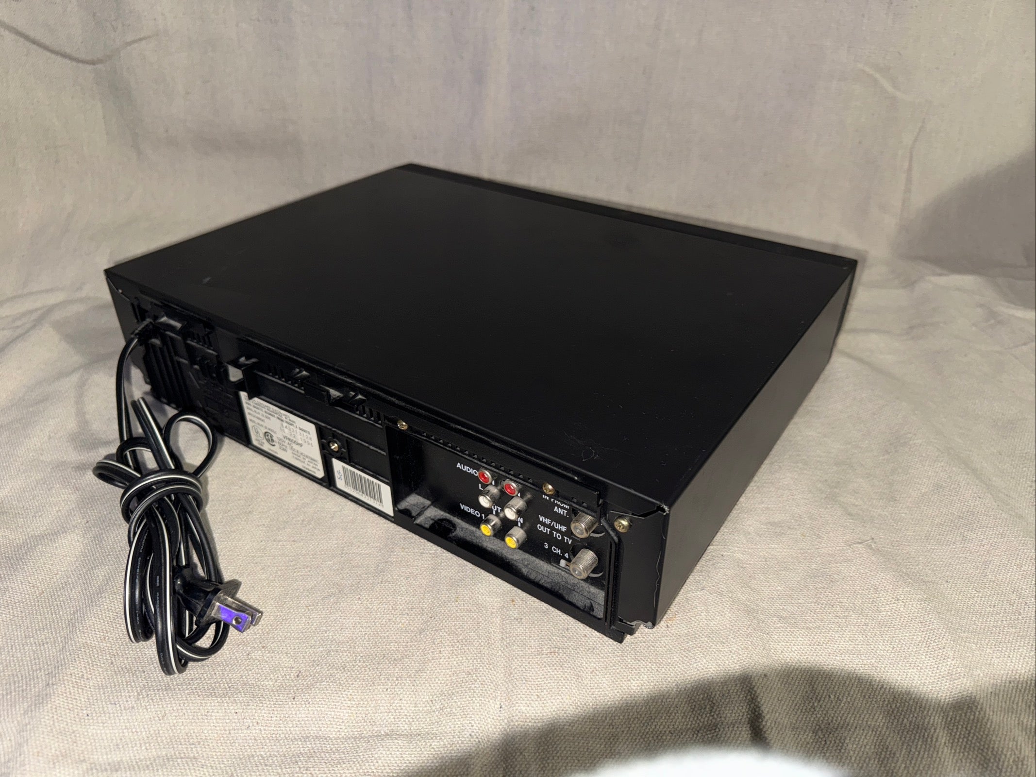Serviced RCA VR606HF VCR VHS Recorder Player showing the back connections and power cord.
