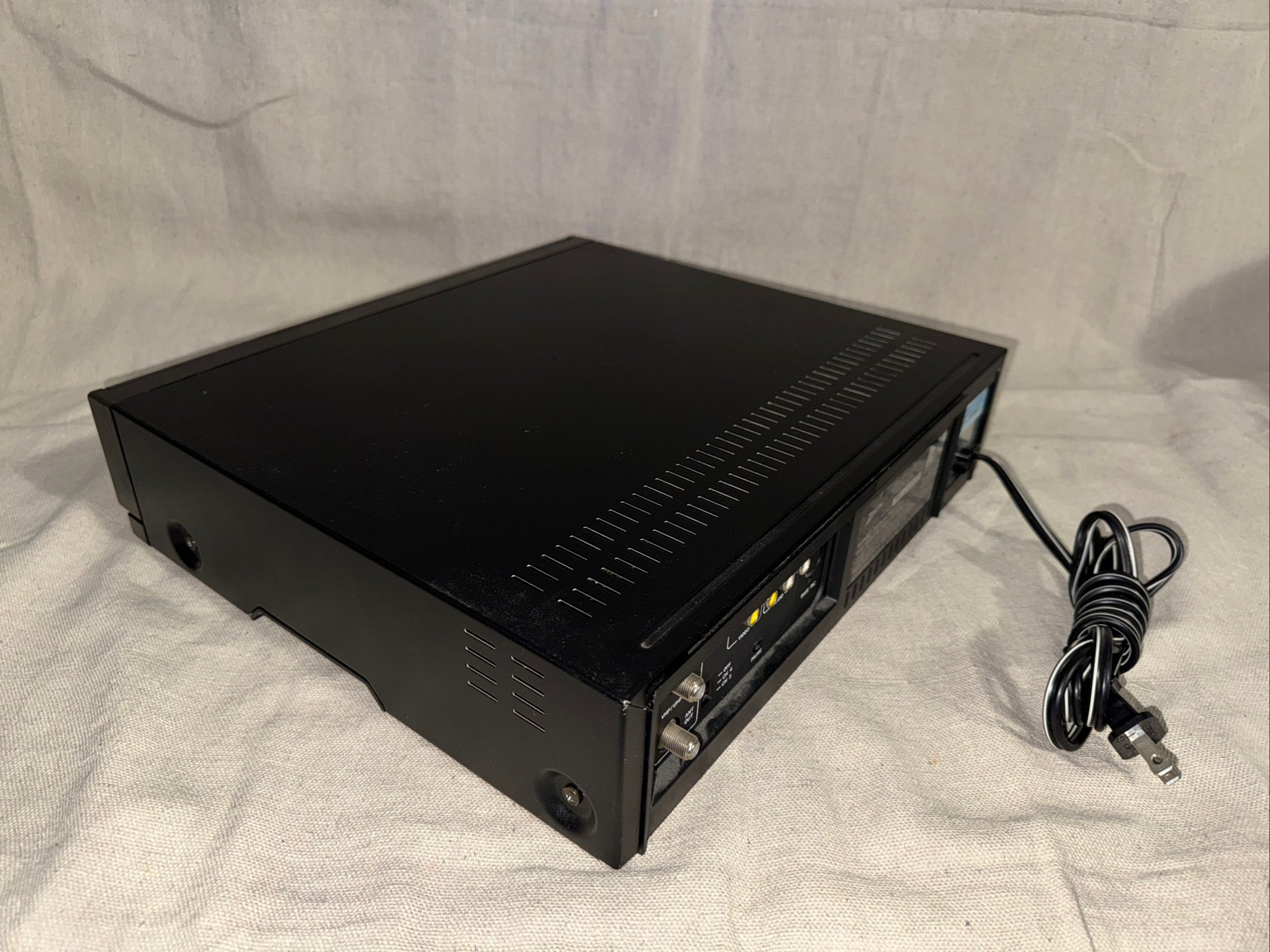 Serviced Zenith VRF250 device shown from the side with power cable and indicators.