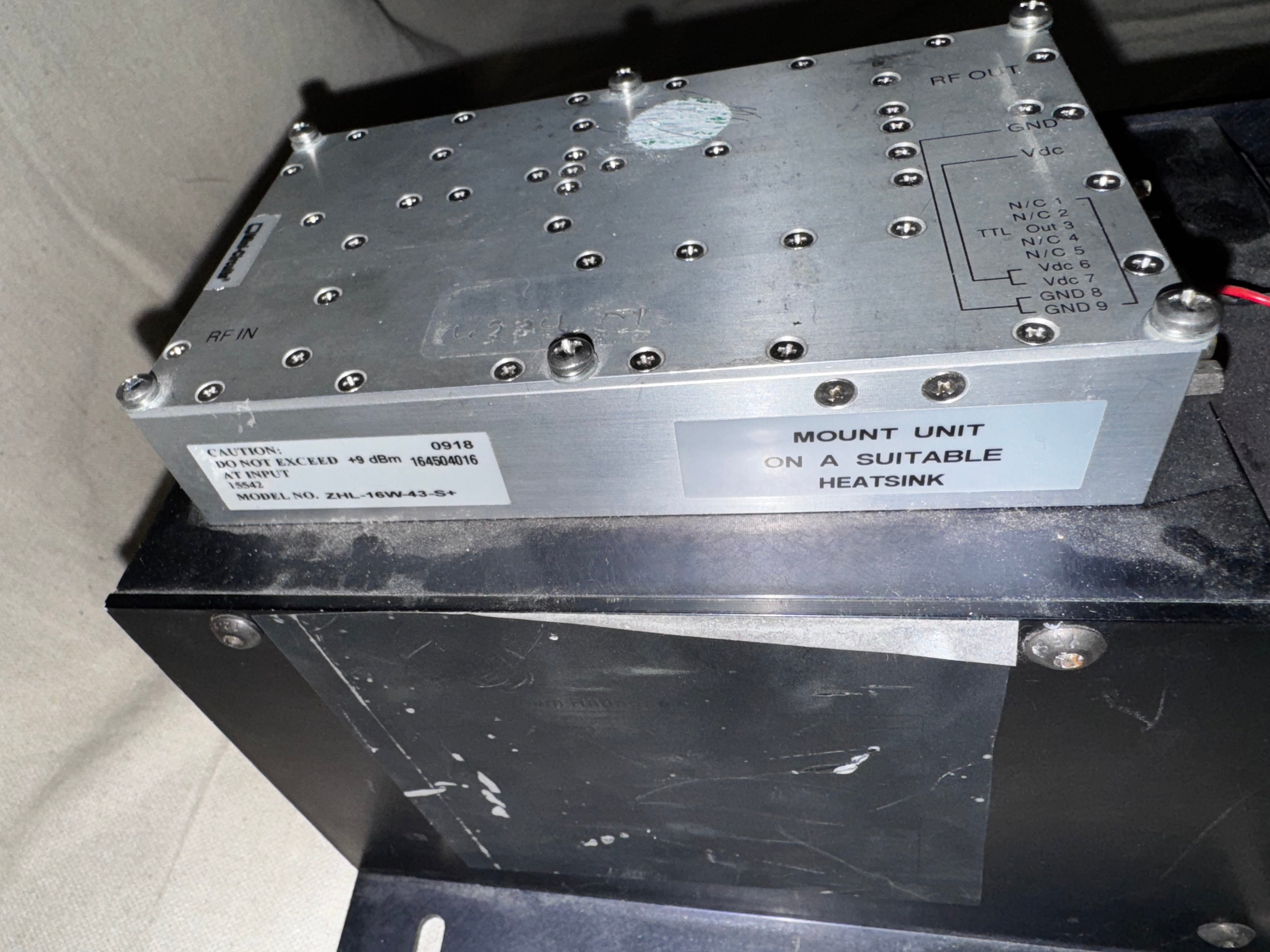 Mini-Circuits ZHL-16W-43-S+ For Parts - Non Functional mounted on a heatsink, showcasing its metal casing.
