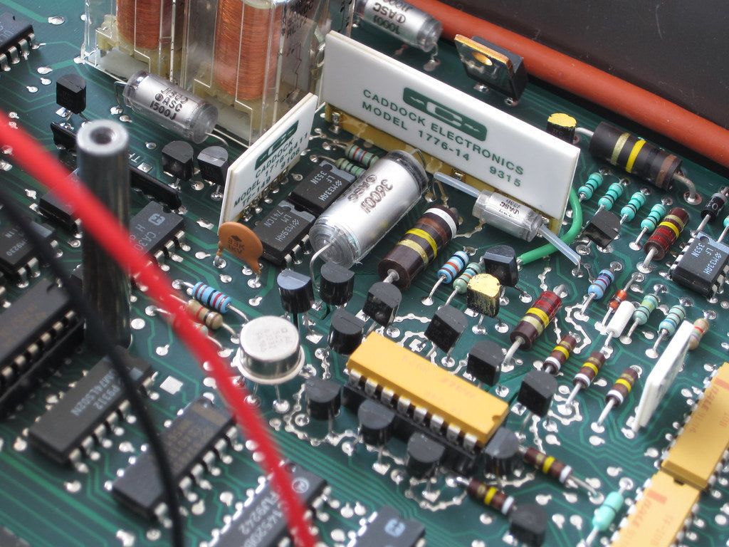 Close-up view of a circuit board featuring components of the Keithley 195A Multimeter Mail In Repair Service Estimate.